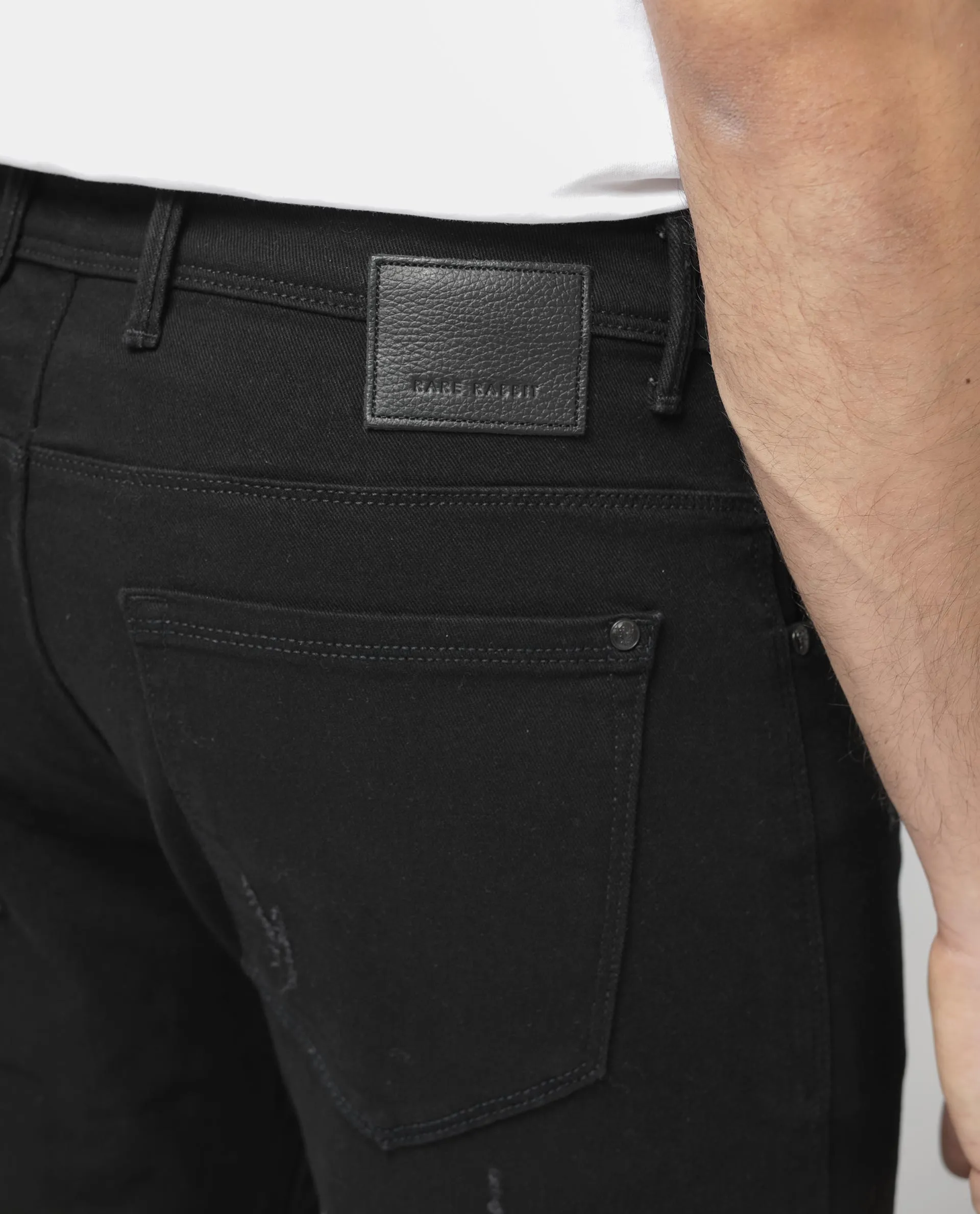 Rare Rabbit Mens Astro Black Cotton Mid Rise Elastane Solid Slim Fit Jeans