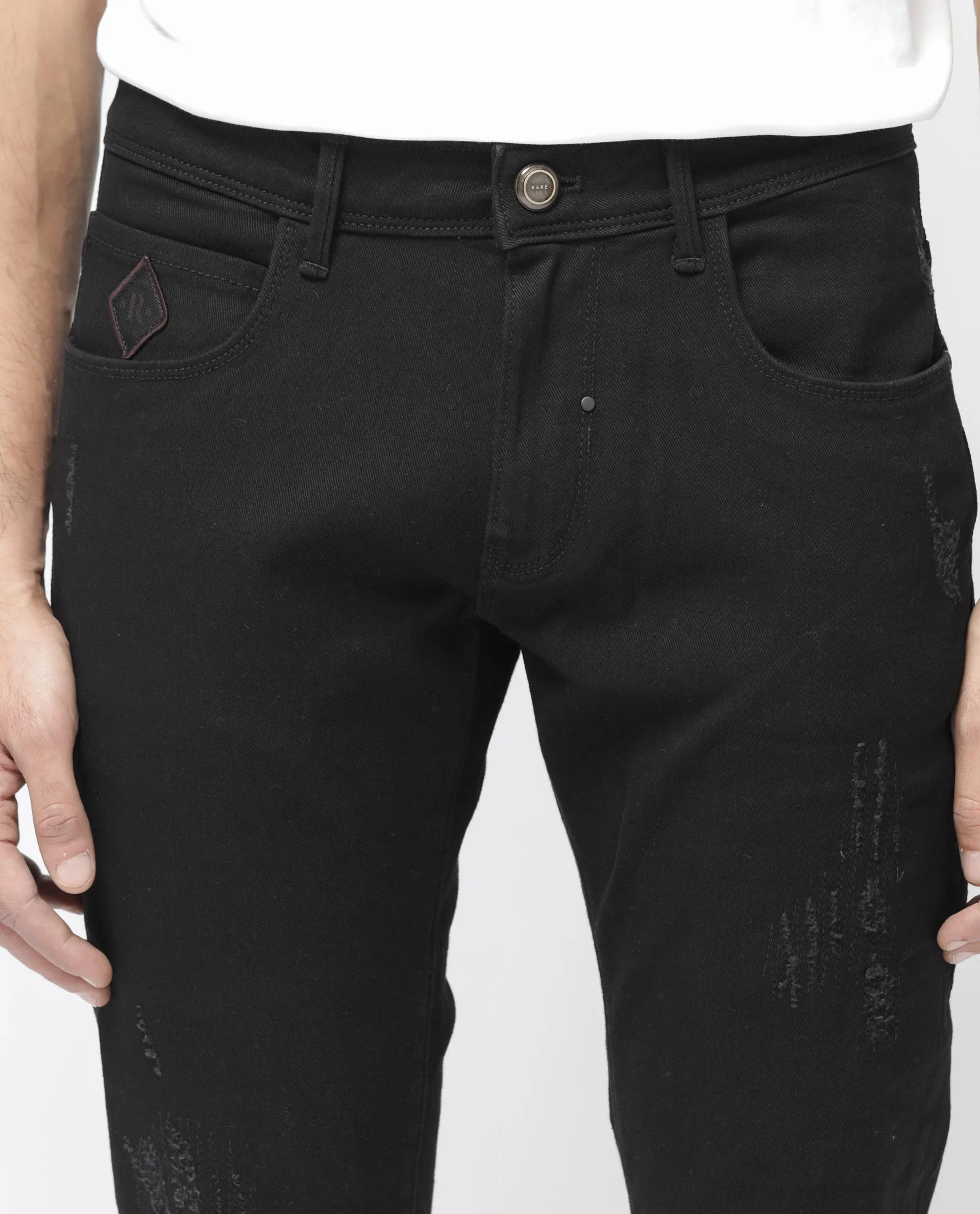 Rare Rabbit Mens Astro Black Cotton Mid Rise Elastane Solid Slim Fit Jeans